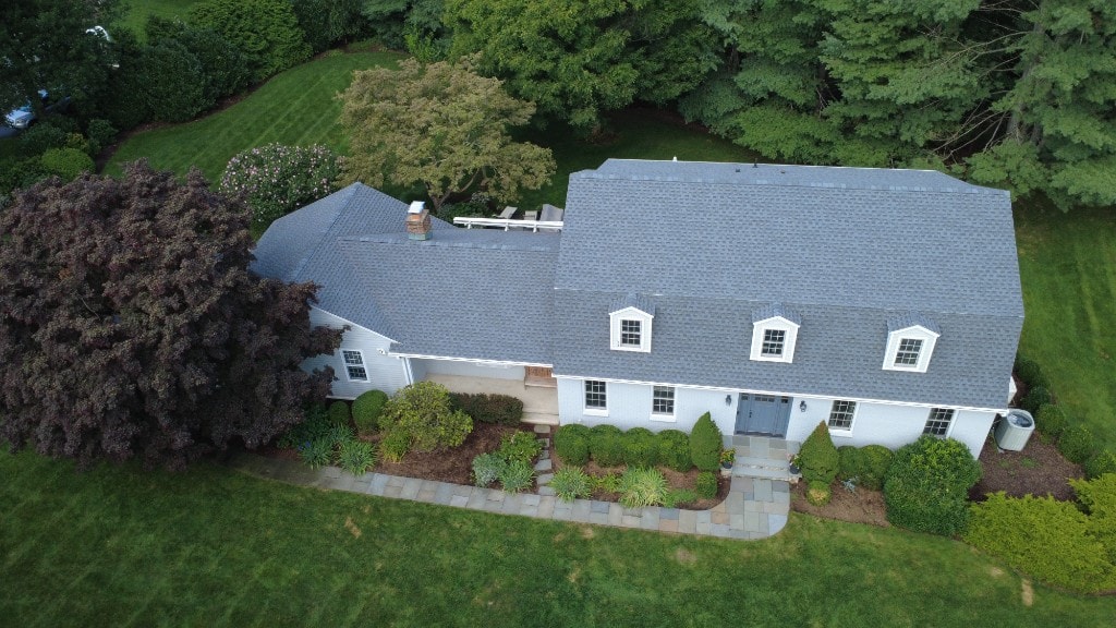 After — completed grey asphalt shingle roof replacement on the same Fairfield County home