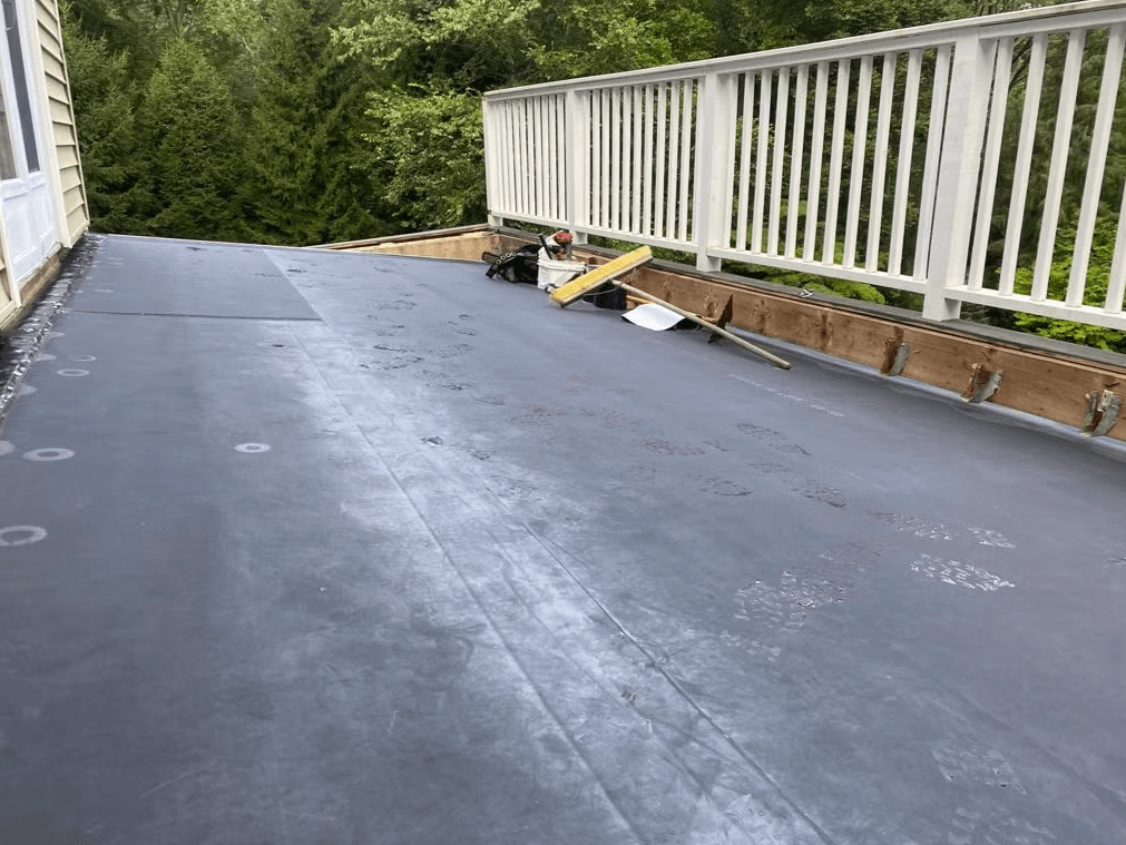 EPDM flat roof membrane installation on a residential deck roof in Fairfield County, Connecticut